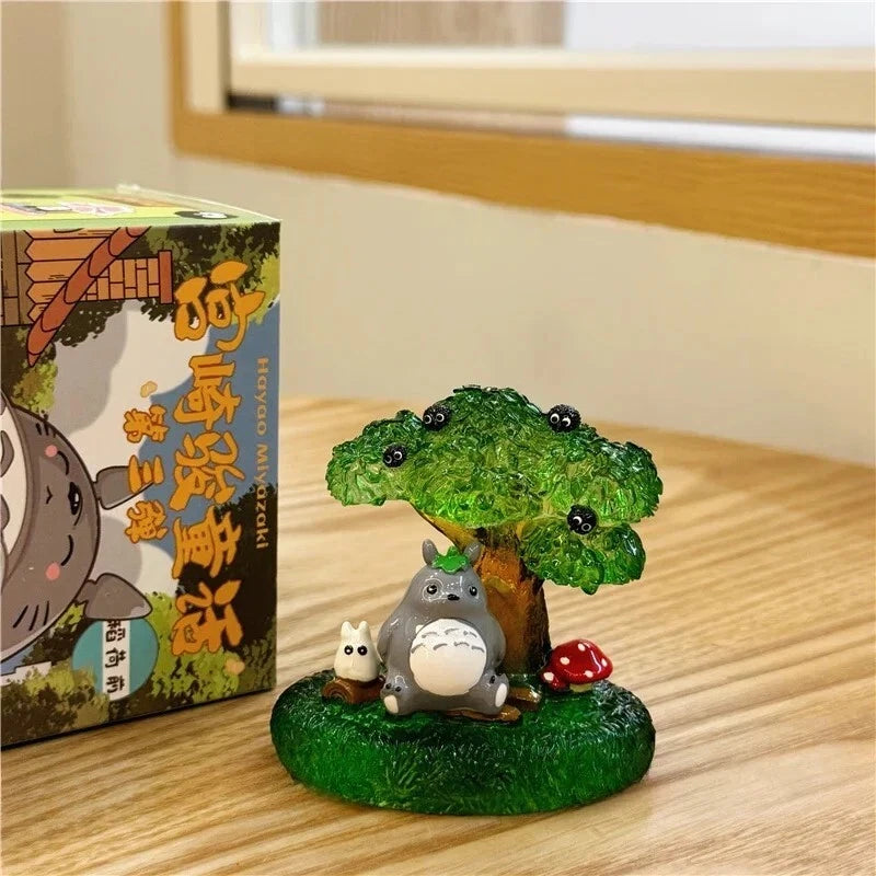 
Ghibli Fairy Tales Series 3 Totoro diorama beneath a green tree, shown beside its retail packaging; one example design.