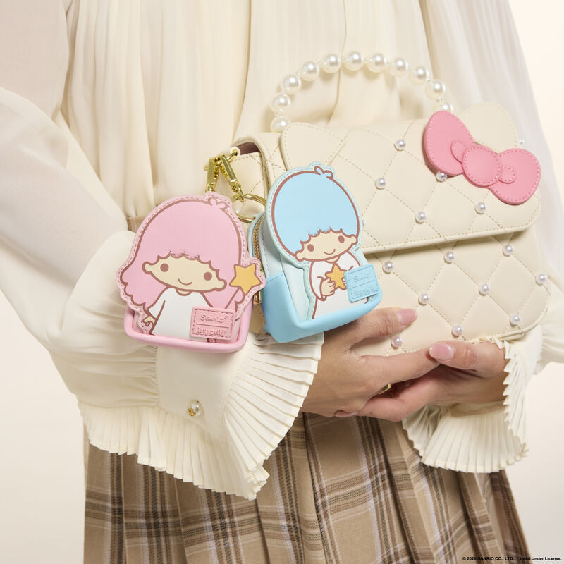 
Kiki and Lala mystery charm examples attached to a larger backpack – backpack not included