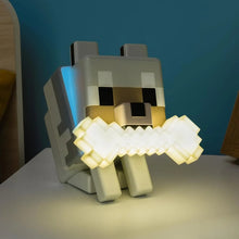 Wolf night light glowing on a desk